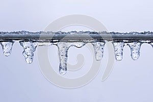 Frozen ice drops on colorless background