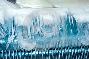 Frozen ice on refrigerator grill