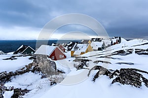 Frozen Inuit houses covered in snow. Nuuk, Greenland