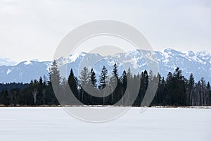 Frozen lake in alpine landscape