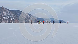 Frozen Lake Baikal, Aerial view. Beautiful winter landscape with clear smooth ice. Famous natural landmark Russia. Blue