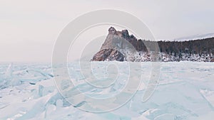 Frozen Lake Baikal, Aerial view. Beautiful winter landscape with clear smooth ice. Famous natural landmark Russia. Blue