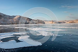 Frozen Lake Baikal. Blue ice, winter landscape