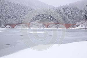 Frozen lake and bridge photo