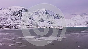 Frozen Lake Flagstadpollen and Mountains in Winter. Lofoten Islands, Norway. Aerial View