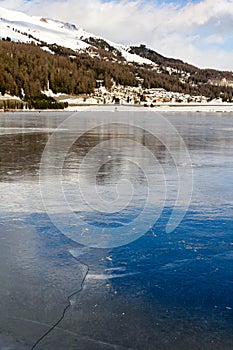 Frozen lake with ice crack on surface