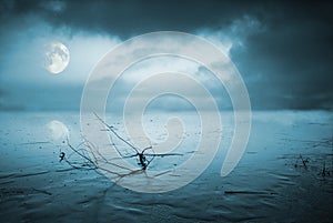 Frozen lake in moonlight photo