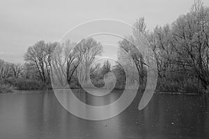 Frozen lake on the outskirts of town