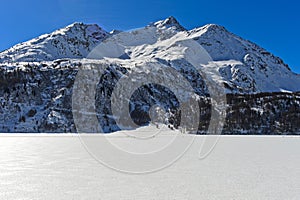 Frozen Lake Sils, Silsersee and Piz de la Margna photo