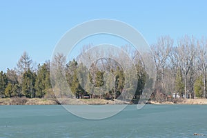 Frozen lake in spring time at Memorial Park Constantin Stere in Bucov, near Ploiesti, Romania