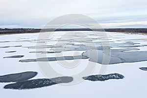 Frozen lake with unfrozen patches