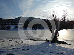 Frozen lake view in winterscape