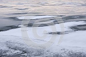 Frozen lake in winter. River ice. Winter landscape
