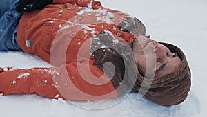 Frozen man lying on the snow