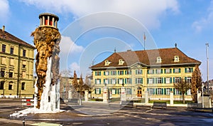 Frozen Meret Oppenheim Fountain and Police office in Bern