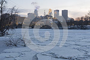 Frozen mississippi river and minneapolis skyline