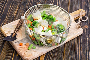 Frozen mixt of vegetables with Brussels and cauliflower, carrots, peas and beans