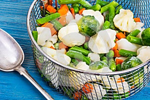 Frozen mixt of vegetables with Brussels and cauliflower, carrots, peas and beans