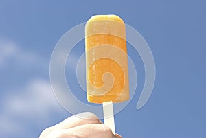 Frozen orange Popsicle