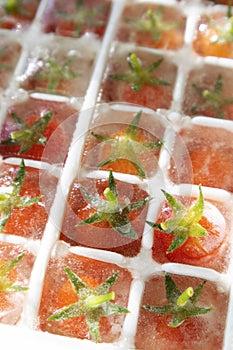 Frozen Pachino tomatoes in small cubes for a refreshing aperitif