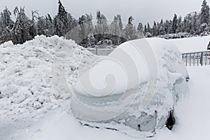 Frozen parked car with icicles