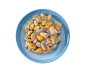 Frozen peeled mussels on a blue ceramic plate isolated on a white background, top view