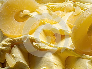 Frozen Pineapple flavour gelato - full frame detail. Close up of a yellow surface texture of Ice cream