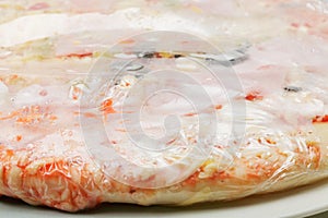 Frozen pizza closeup