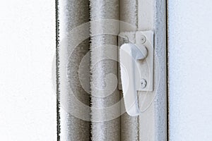 Frozen plastic window hardware lock.