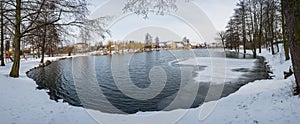 Frozen pond lake in countryside village of Ustek