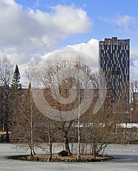 Frozen pond and tall building in Tampere