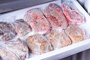 Frozen pork neck chops meat steakin the freezer