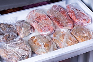 Frozen pork neck chops meat steakin the freezer. Frozen food