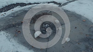 Frozen Puddle with Cracked Ice. Winter and Ice concept. Winter Is Coming. Snow Time December, January and February