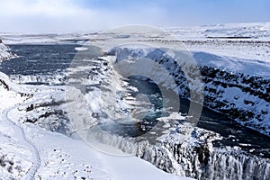 A Frozen Rainbow Rising Over The Falls