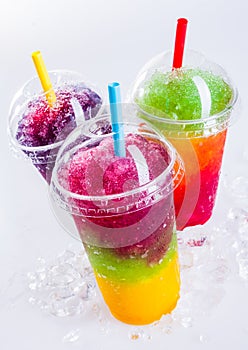 Frozen Rainbow Slush Drinks Chilling on Ice