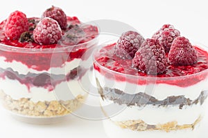 Frozen raspberries with cereals and yoghurt.