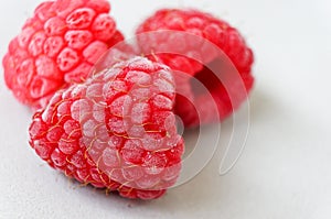 Frozen raspberry texture close up for background