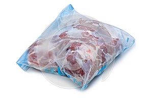 Frozen raw pork wrapped in plastic bag