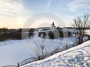 frozen river and Church of Elijah in Suzdal