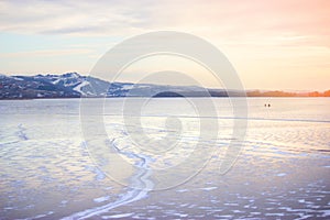 Frozen River and distant mountains