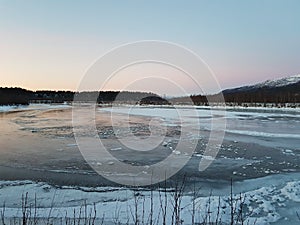 Frozen river landscape in the arctic circle