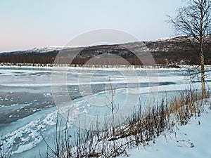 Frozen river landscape in the arctic circle