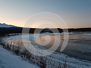 Frozen river landscape in the arctic circle