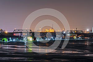 Frozen river, night and ice anglers