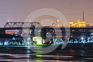 Frozen river, night and ice anglers