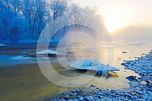 The frozen river snow and ice crystals sunrise