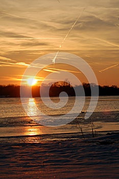 Frozen river sunset
