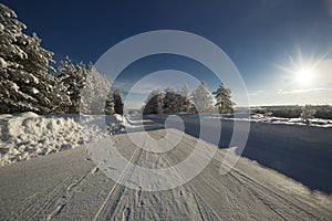 A frozen road with sun.Winter in Lapland, Sweden, Norrbotten