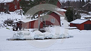 Frozen rocks on shore of lake Siljan in Tallberg near Rattvik in Dalarna in Sweden photo